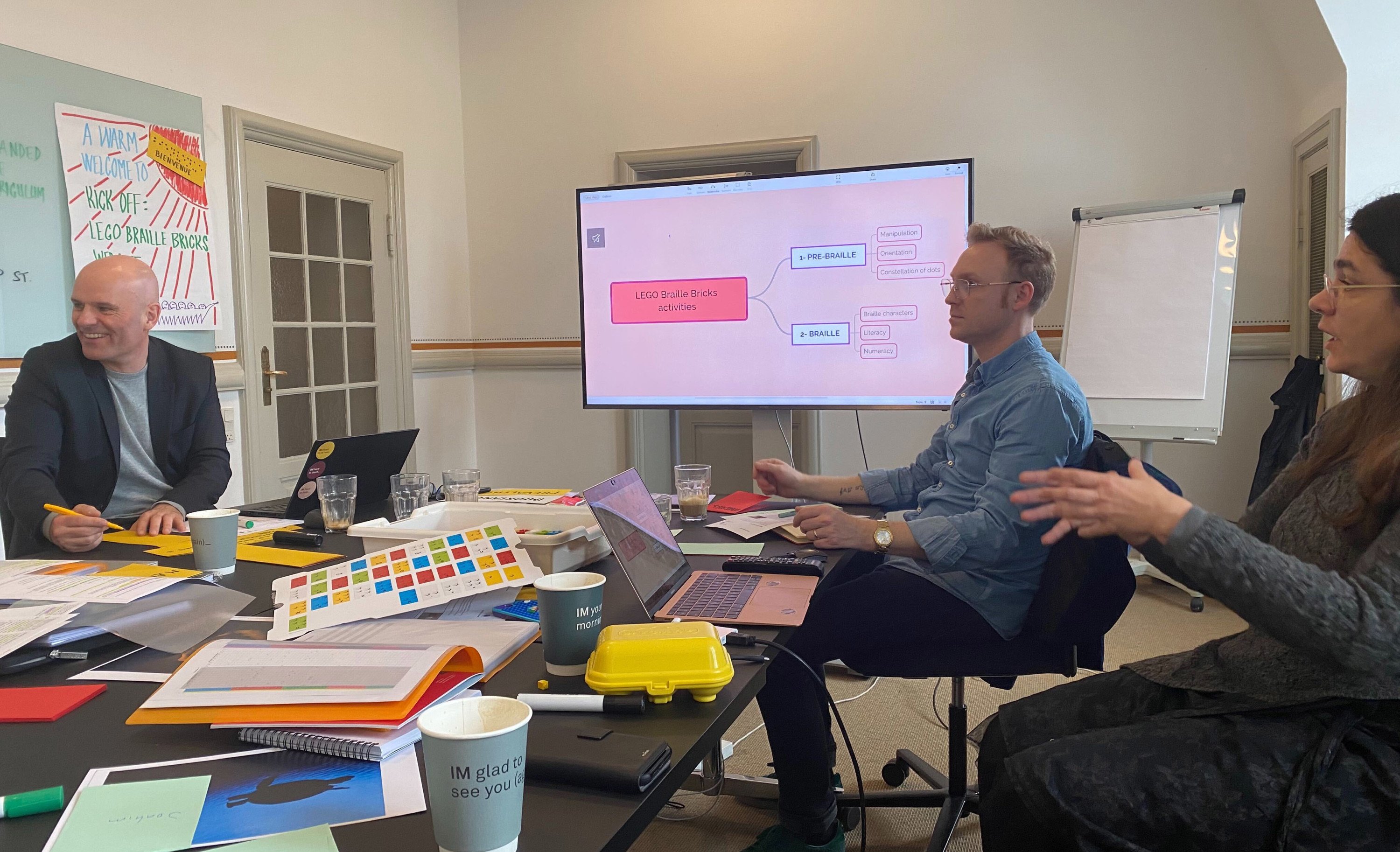 The team working around a table